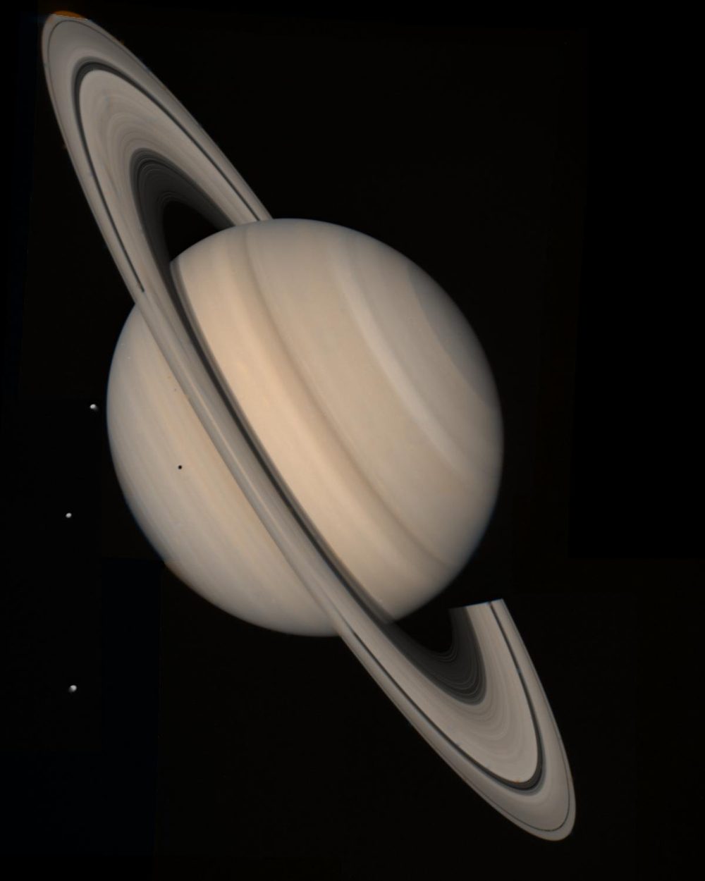 Tilted ringed planet, the ring shadow across its globe, three small points at left