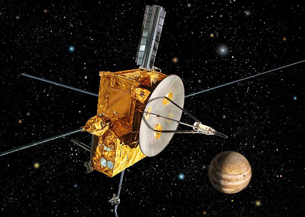 Painted gold-foiled spacecraft with a dish and long booms, a banded planet at lower right