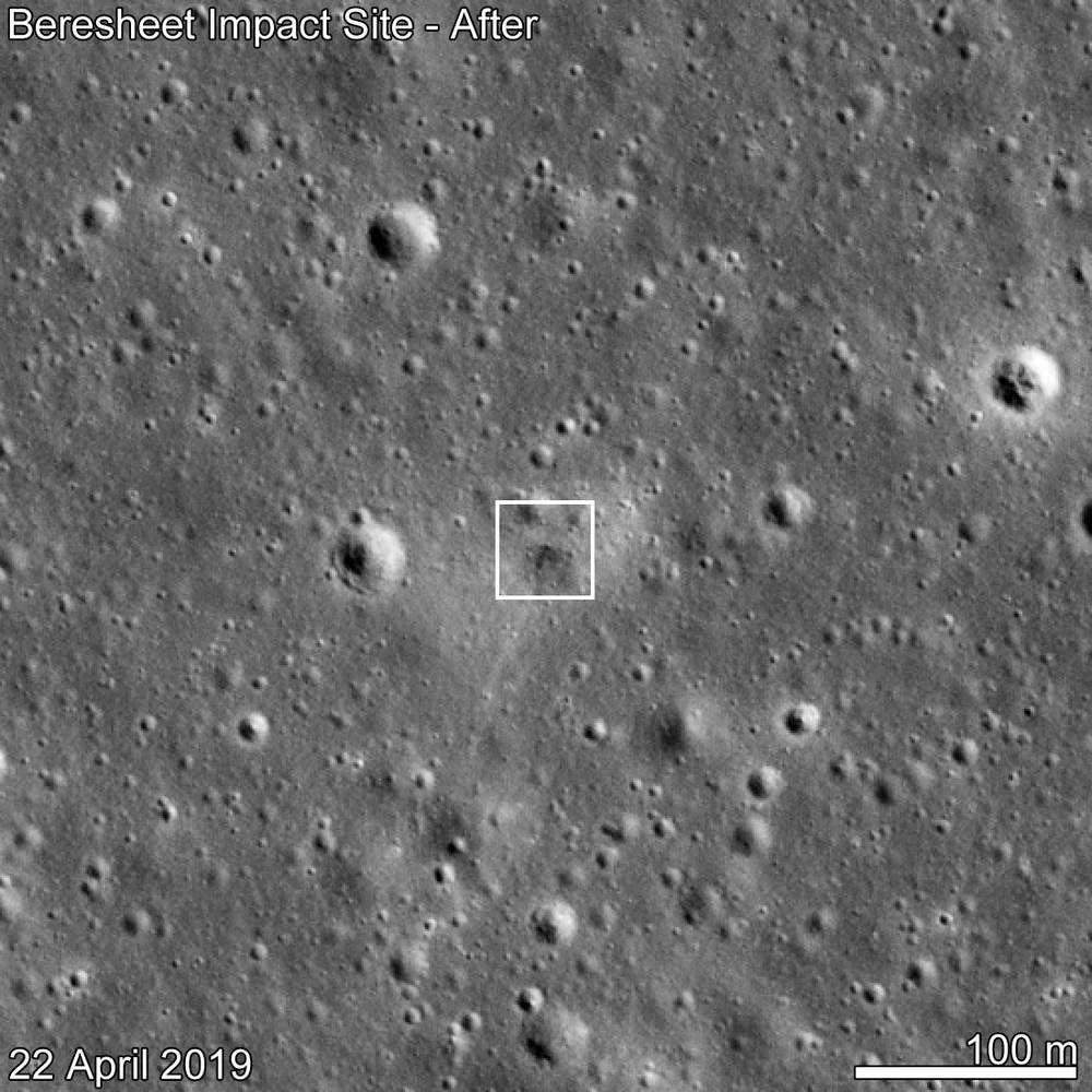 Greyscale orbital image of a cratered plain, a small white box round a dark patch