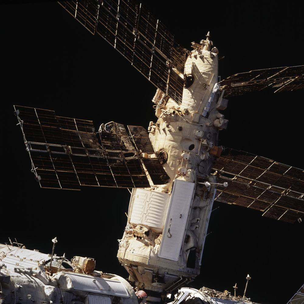 Close view of a module whose solar array is buckled and torn along its spine
